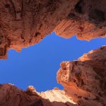 Moon Cave at Cathedral Gorge in Nevada isn't a cavern. It's a slot canyon. Looking up, you see a strip of the sky running between the canyon walls.